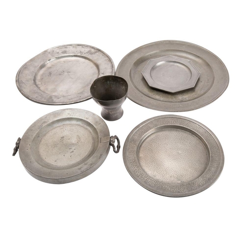 518 - A small group of pewterwares includes;- a late 18th century English pewter charger, 38cm diameter, a... 