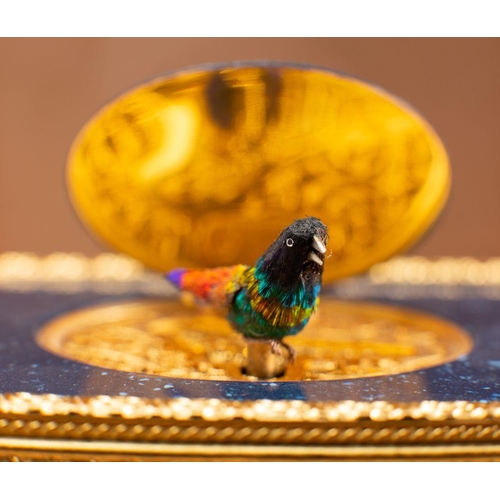 537 - Reuge Music, a Swiss musical box, the flip-up feather covered bird with moving beak and wings,  in a... 