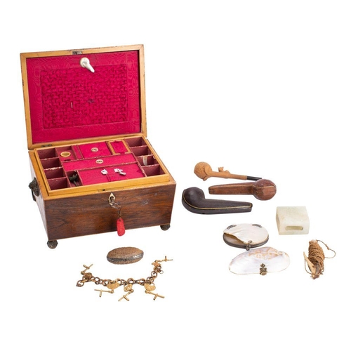 552 - A 19th century rosewood and boxwood strung sewing box with lift out tray, raised on peg feet, amber ... 