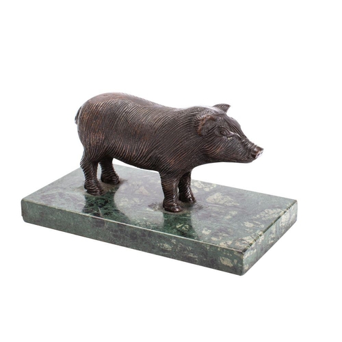 570 - A bronze model of a pig mounted on a polished variegated green marble base, unsigned 17.5cm long.