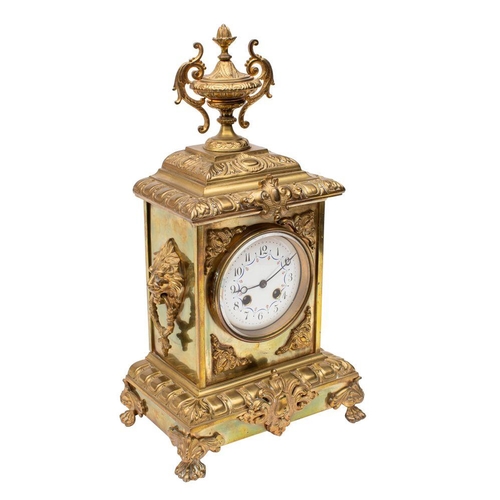 656 - S. Marti, Paris, a decorative brass mantel clock,  the eight-day duration movement striking the hour... 