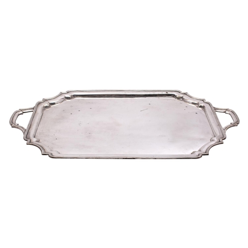 2091 - A large electro-plated serving tray of rectangular outline, with moulded border and loop carrying ha... 