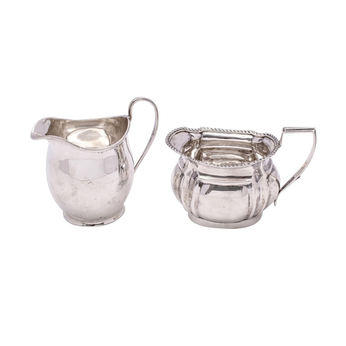 2117 - An Edward VII silver cream jug, maker Thomas Hayes, Birmingham, 1904 of barge-shaped outline, with g... 