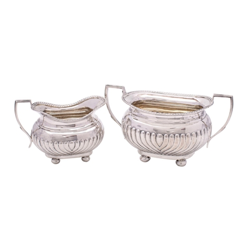 2120 - A late Victorian two-piece tea service, maker GAG, Sheffield, 1899 of barge-shaped outline with gadr... 