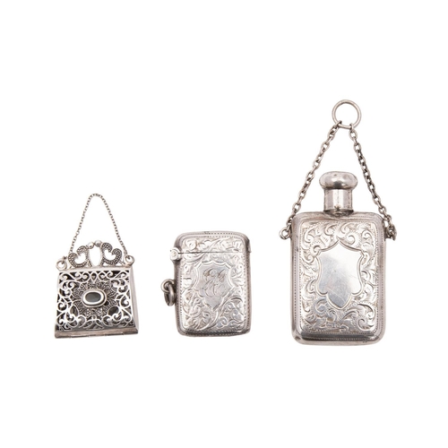 2264 - A filigree silver miniature purse 3cm wide, a silver vesta case and small silver scent bottle, 6cm h... 