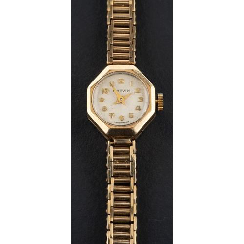 2377 - Marvin, a dress wristwatch, the enamel circular dial with Arabic numerals, the 9ct gold, integrated ... 