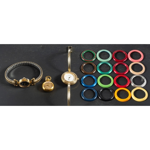 2378 - Three gilt metal dress watches, including a Gucci wristwatch with 16 vari-coloured plastic, removabl... 