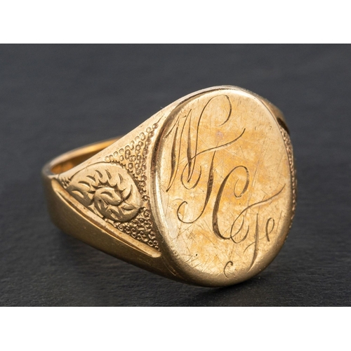 2412 - A 9ct gold signet ring, engraved with initials 'WTCF', with hallmarks for London, 1967, length of ri... 