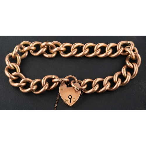 2446 - A curb-link bracelet with heart-shaped clasp, the clasp stamped '9CT', the links stamped '9C', total... 