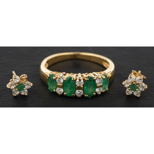 2479 - A marquise-shaped emerald, three-stone ring with round, brilliant-cut diamond spacers, total diamond... 