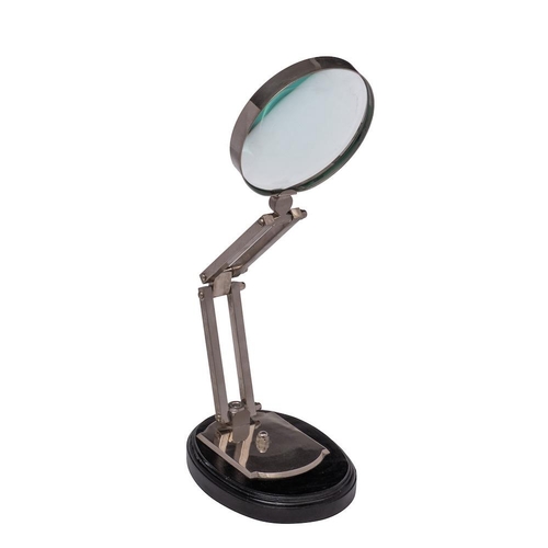 336 - A chrome plated angle-poise  desk magnifying glass with 12cm circular lens mounted on an ebonised ov... 