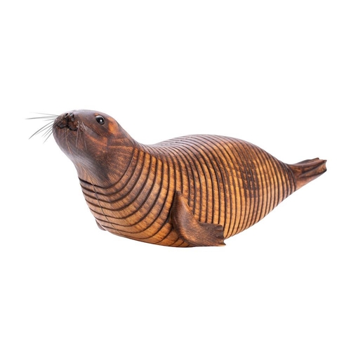 340 - Almost certainly Jeff Soan, (British, contemporary), an articulated beechwood model of a seal, with ... 