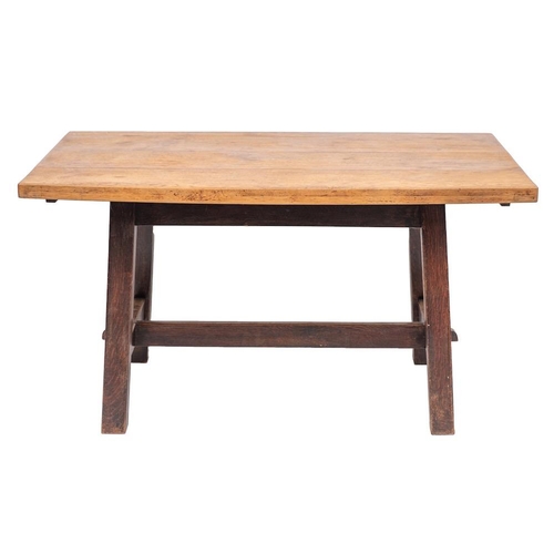 106 - An oak trestle table in Arts & Crafts taste, early 20th century; the rectangular top on slightly spl... 