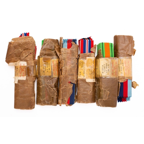 259 - A group of six packets of British Campaign Medal ribbons, including 1939-45 War Medal in remains of ... 