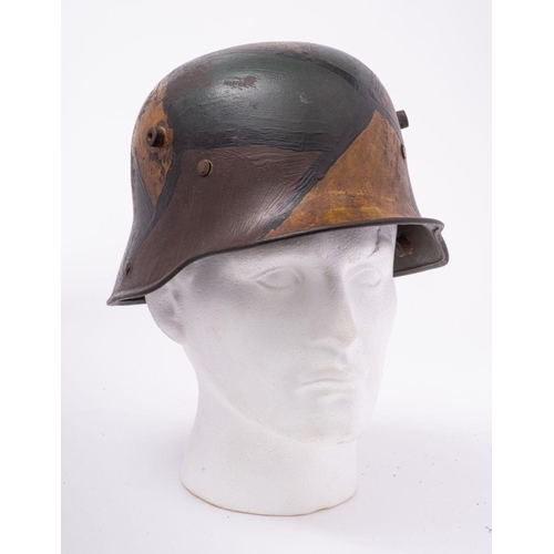 329 - A WWI period German M1916 Stahlhelm,  hand painted camouflage finish with brown leather liner, the h... 