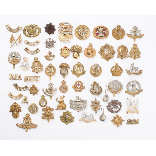 365 - A collection of fifty five British regimental cap and shoulder badges, including York and Lancashire... 