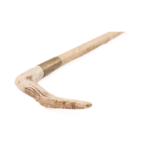 51 - A Swaine antler handled riding crop with silver plated ferrule and cord bound shaft.