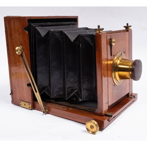 556 - A Perkin Son & Rayment  mahogany and brass half plate field camera,  fitted lens engraved 'Made Abro... 