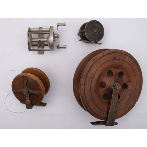 575 - A late 19th century mahogany and brass star back reel, with double horn handles, together with a 6 i... 