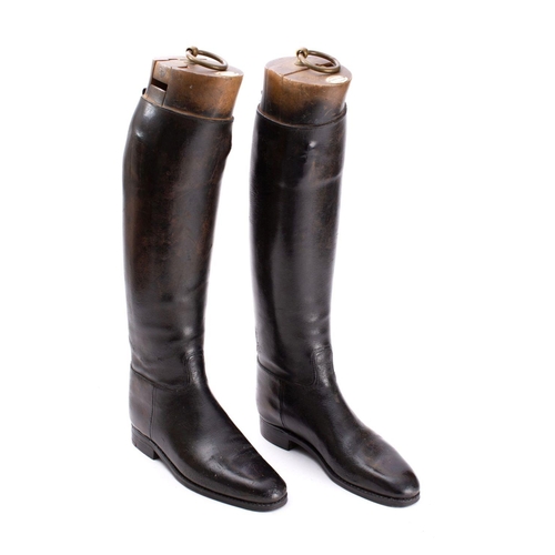 58 - A pair of Maxwell  black leather riding boots with wooden trees.