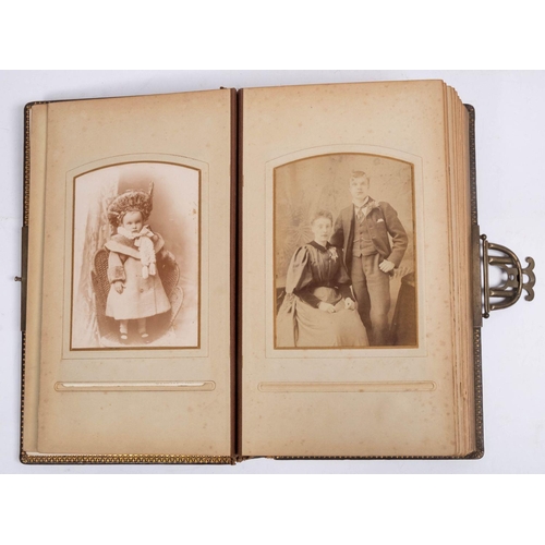 672 - An Edwardian Carte de Visite album containing family portraits, various photographers, together with... 