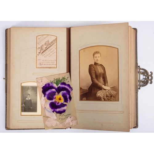 672 - An Edwardian Carte de Visite album containing family portraits, various photographers, together with... 