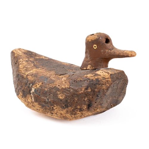 88 - A late 19th/early 20th century  decoy duck with traces of original decoration, 28cm long.