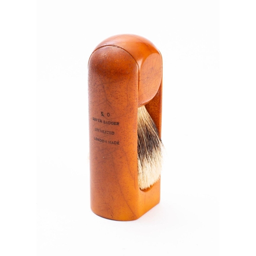 1210 - A Louis Vuitton travel shaving brush,  the badger hair brush on a rotating resin  handle.