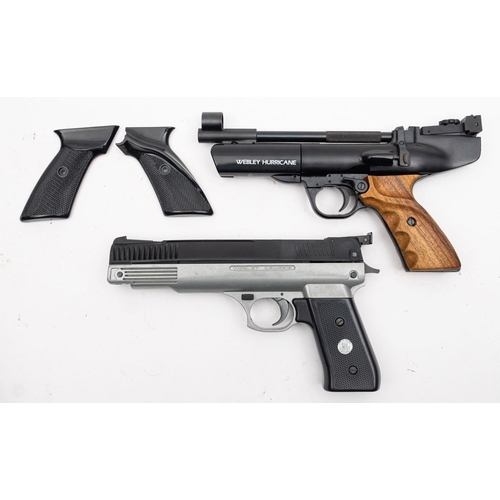 122 - A Webley Hurricane .22 calibre air pistol,  black finish with two piece wooden grip, with spare blac... 