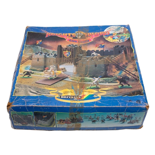 1229 - Britains and others.  A boxed Knights of the Sword 'Lion Castle', together with a collection of loos... 