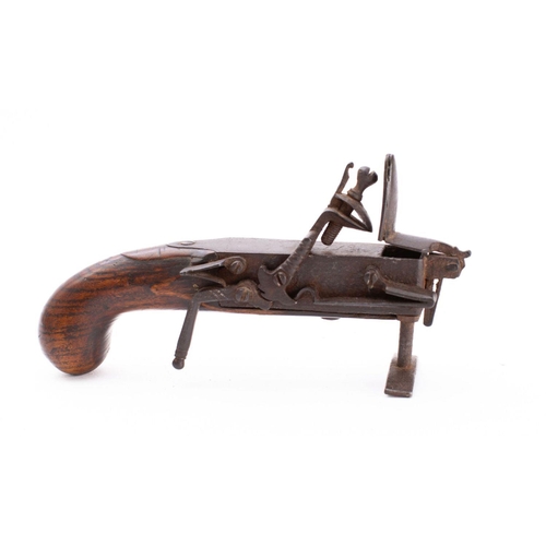 184 - A late 18th century steel flintlock tinder pistol,  the box section frame with sidelock action oppos... 