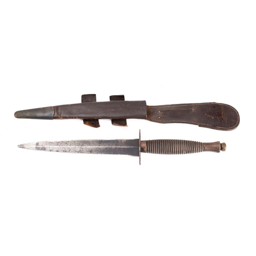 208 - A British Third Pattern Fairbairn Sykes Fighting Knife, the straight double edged blade on a blued o... 