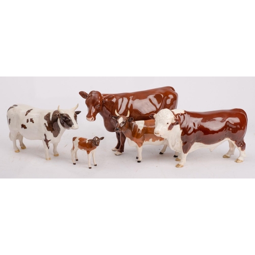 24 - A group of Beswick cattle comprising an Ayrshire cow, Champion Ickham Bessie, Ayrshire bull, Champio... 