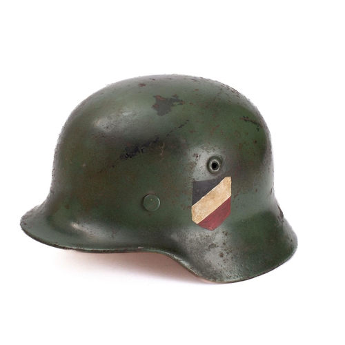 285 - A WWII period M1942 pattern Youth's Stahlhelm  green with National colours to one side and applied r... 