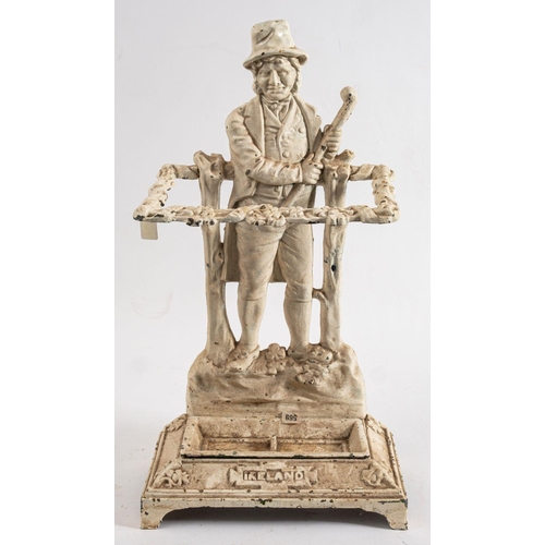 36 - A cast iron 'Ireland' umbrella stand: the backplate depicting an 18th century Irishman wearing breec... 