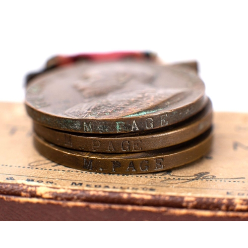 385 - A WWI period 1914 Christmas tin, together with three London County Council King's Medals, a Sargent'... 