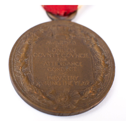 385 - A WWI period 1914 Christmas tin, together with three London County Council King's Medals, a Sargent'... 