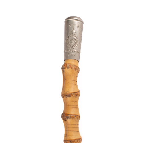 391 - Winchester College Officer Training Corp. A silver plate mounted bamboo swagger stick, 67cm long