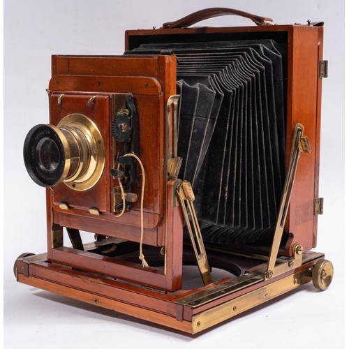 555 - A Thornton Packard 'Triple Imperial' mahogany and brass three quarter plate camera,  fitted Thornton... 