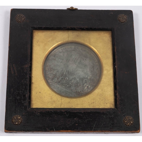 696 - An 18th century alloy single sided 'Siege De La Bastille' medallion after Andrieu mounted in an ebon... 