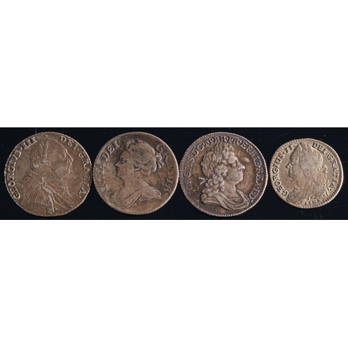 756 - A 1720 shilling (roses and plumes): together with 1709 and 1748 shillings and a 1745 sixpence.(4)