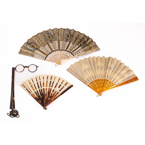 796 - A late nineteenth century mother of pearl and lace fan in a Selfridge box, together with two cellulo... 