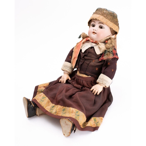 838 - A late 19th century continental bisque head doll,   applied brunette wig , brown glass sleeping eyes... 