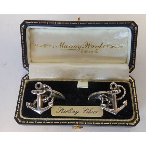 39 - A pair of silver cuff links, stamped marks, in the form of fouled anchors, cased.