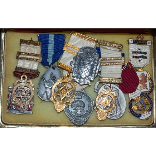 350 - A group of ten various Masonic jewels, together with a collection of various aprons and regalia.