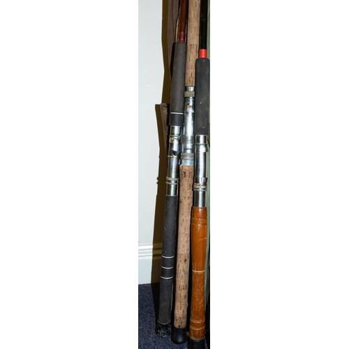 565 - A collection of various sea fishing rods.