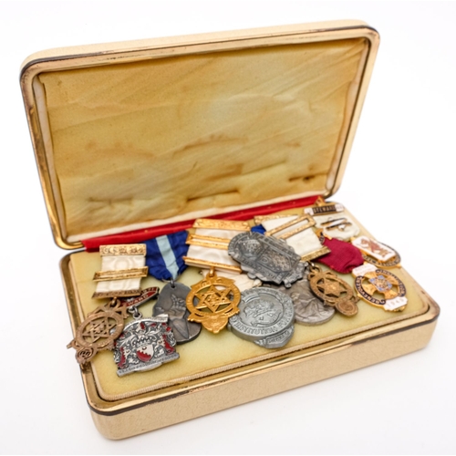 350 - A group of ten various Masonic jewels, together with a collection of various aprons and regalia.