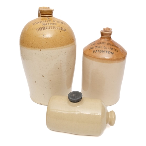 13 - Two Honey top spirit jars and a hot water bottle, the largest stamped 'Wright & Son, Grocers, Dorche... 