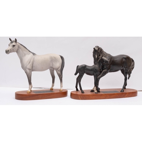 33 - A Beswick Connoisseur model 'Black Beauty and Foal' on wooden base, 20cm high, together with another... 