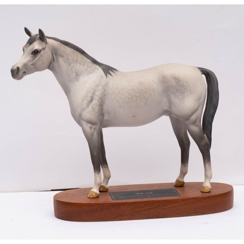 33 - A Beswick Connoisseur model 'Black Beauty and Foal' on wooden base, 20cm high, together with another... 